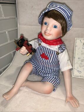 Hand painted porcelain doll Andy the engineer by Ashton Drake with certificate